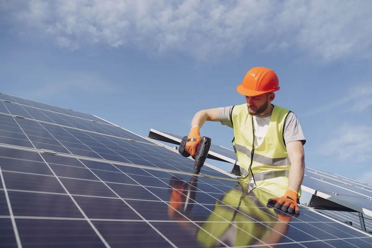 solar panels being installed on a roof