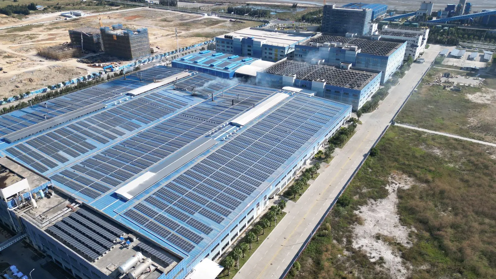 aerial view of solar panels on an industrial building roof